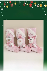 Detail of pink sequin Christmas stockings with cartoon snowman, santa and reindeer