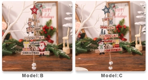 Detail of wooden Christmas tree hangings with Santa and Snowman motifs and metal bells
