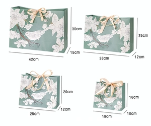 Green floral paper gift bags set in four different sizes with ribbon handles dimensions