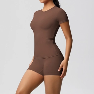 Detail of coffee brown seamless athletic yoga set featuring ribbed high-stretch fabric