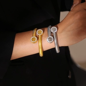 Gold and silver life tree cuff bracelet with pavé rhinestones in 18k gold plating