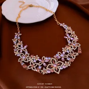 Elegant floral necklace set with colorful crystals and rhinestones in gold finish