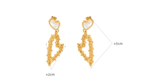 Detail view of gold heart earrings with woven texture and white shell inlay, 5cm height