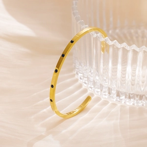 Minimalist 18k gold plated stainless steel cuff bracelet with five deep blue gemstones