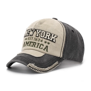 Detailed close-up of 3D embroidery on retro New York patchwork baseball cap brim