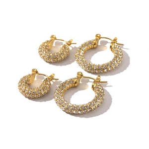 Detailed view of two pairs of 18k gold plated hoop earrings with white cubic zirconia