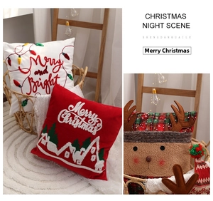 Cozy home Christmas scene featuring embroidered pillows and reindeer cushion in a basket