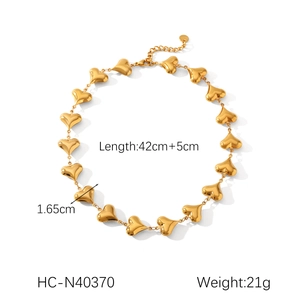 Detail view of 18K gold plated stainless steel hollow heart pendant necklace with mirror finish