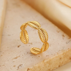 Macro detail of gold-plated adjustable ring featuring textured oval linked motifs