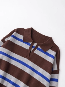 Detailed close-up of retro striped polo knit top with blue, brown, and grey patterns
