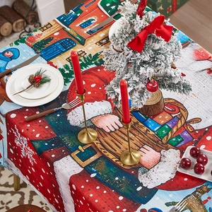 Christmas tablecloth featuring Santa Claus and snowy town scenery for festive table decor