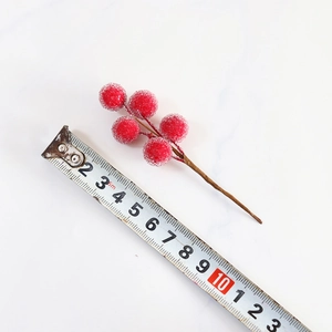 Artificial red frosted berry stems for Christmas decor, size 10cm measurement shot