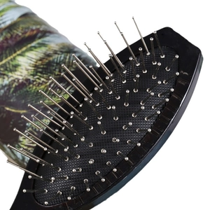 Oval hairbrush with steel pins and floral patterned handle for wig and extension care