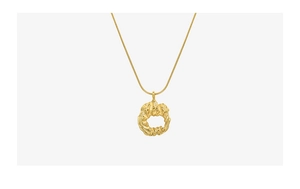 Detailed view of the 18k gold plated irregular round textured pendant on a snake chain