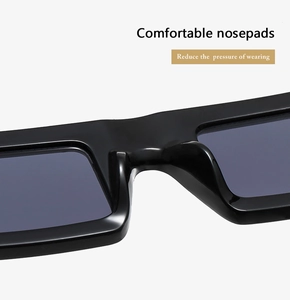 Detail view of smooth integrated nose pads on black square sunglasses for comfort