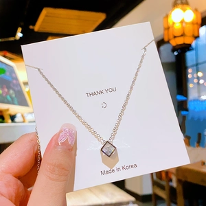 Minimalist silver titanium steel necklace with square cubic zirconia pendant on display card