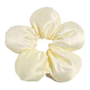 Oversized satin flower hair scrunchie in pale yellow with a silky texture and elegant finish
