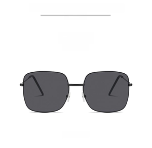 Front detail of square sunglasses with thin black metal frames and dark gray lenses