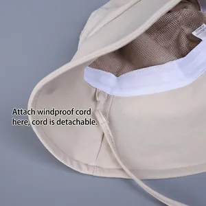 Beige wide brim sun hat with breathable mesh lining and detachable windproof chin strap