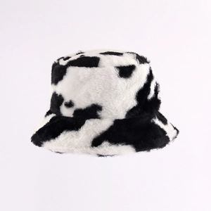 Stylish black and white cow print plush bucket hat for women with soft faux fur texture