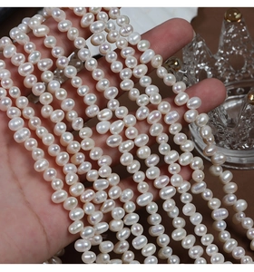 Macro shot of 4-5mm irregular rice-shaped natural freshwater pearls with lustrous finish