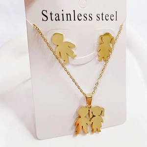 Golden stainless steel jewelry set featuring boy and girl pendant necklace and stud earrings