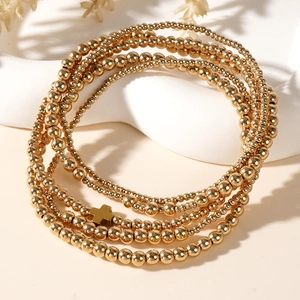 Chic 5-piece gold beaded layered bracelet set featuring a delicate cross charm