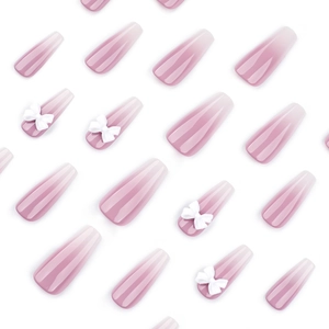 French gradient press-on nails in long coffin shape with white bow accents