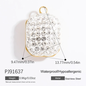 Macro detail of rectangle stainless steel pendant with white center and gold border