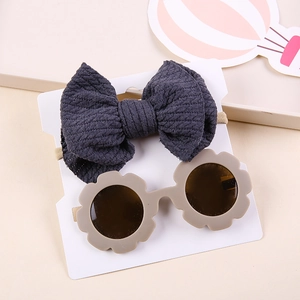 Baby stripe bow headband and flower sunglasses set on display card for children