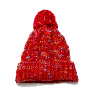 Close-up of thick chunky knit texture and colorful mixed yarn on winter beanie hat