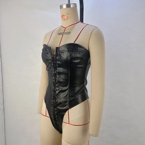 Detail of black glossy PU leather bodysuit with front lace-up eyelets and tube top style