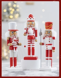 Detailed view of red and white wooden nutcracker soldier set with festive Christmas lighting