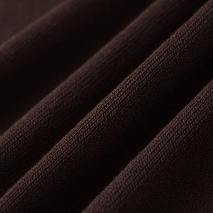 Deep brown ribbed knit polo top with fine texture and soft fabric detailing