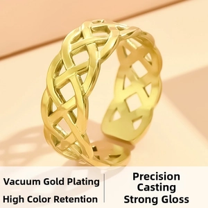 Macro detail of gold plated woven knot ring showing fine casting and high luster finish