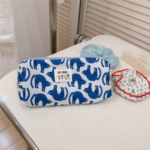 Detail of blue cat print pencil case with lavender zipper and embroidered best tag