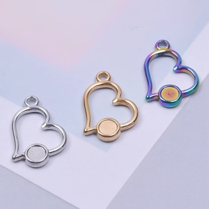 Three heart-shaped stainless steel DIY pendants in gold, silver, and rainbow finishes
