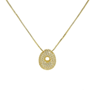 Macro shot of 18k gold plated bubble necklace pendant with full zircon pavé setting