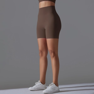 Close-up of dark coffee high-waisted seamless yoga shorts with ribbed waistband support