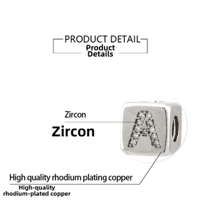Detail view of cube letter A charm with cubic zirconia inlay in rhodium plating copper