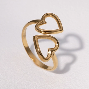 Adjustable golden stainless steel open ring featuring a double heart cutout design