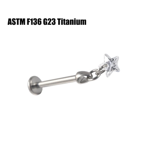 Detail of G23 Titanium labret stud with star cubic zirconia inlay and flat back design