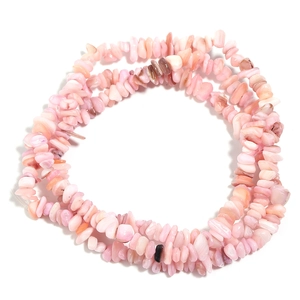 Detailed view of pink natural shell chip beads for DIY jewelry making and crafts