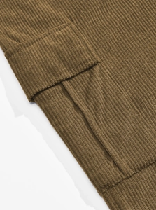 Detailed view of coffee brown corduroy jacket cuffs and pocket stitching craftsmanship