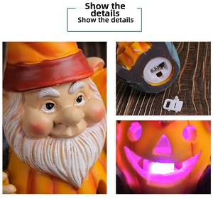 Detail of Halloween gnome resin figurine featuring LED light and bottom battery switch