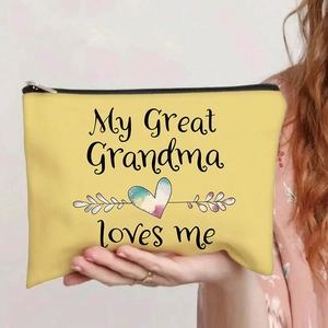 Close-up of yellow canvas makeup bag with Grandma rainbow heart design and zipper