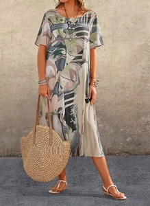 Detail of artistic abstract print and cotton texture on short sleeve midi dress