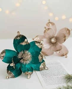 Macro shot of 20cm dark green velvet Christmas magnolia with gold glitter edges and stamen