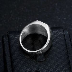 Minimalist men's titanium steel ring with smooth black stone inlay and polished silver finish