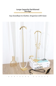 Detail of high-end gold metal necklace display stands in various heights for jewelry shops